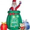 Coming Soon Gemmy Giant Animated Christmas Airblown Inflatable Inflatable Santa In A Gift Bag, 10 Ft Tall, Green